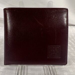 1127: Givenchy Burgundy Leather Bifold Wallet Made in Spain